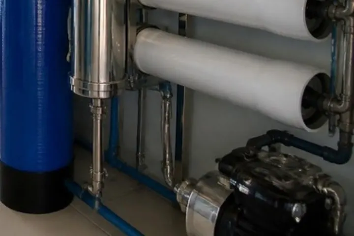 Water pump and pipework at the base of a filtration line